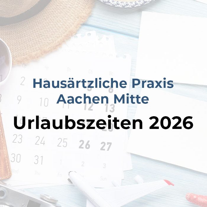 Beitragsbild zu den Urlaubszeiten 2026, Tisch mit Kalender und Reiseutensilien.